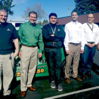 Jon Simms, in green, with his TeamLogic IT of Mountain View team.