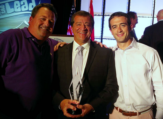Jim Hackett with his VP of Operations Ken Patterson, left, and son Andy Hackett, right. The Hacketts won an award at the 2013 TeamLogic IT convention for having the highest sales volume.