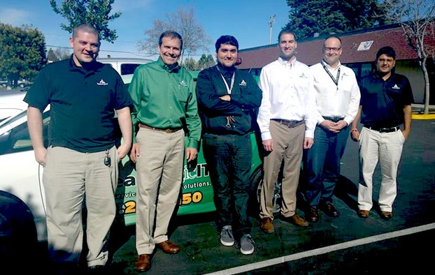 Jon Simms, in green, with his team at TeamLogic IT of Mountain View, California.