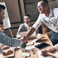 Business Coaches for IT Franchsie shake hands